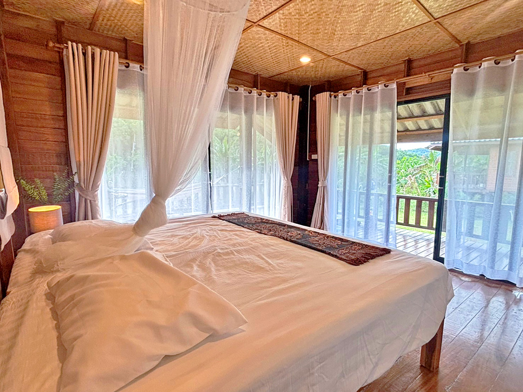 Comfortable bedroom with mosquito net